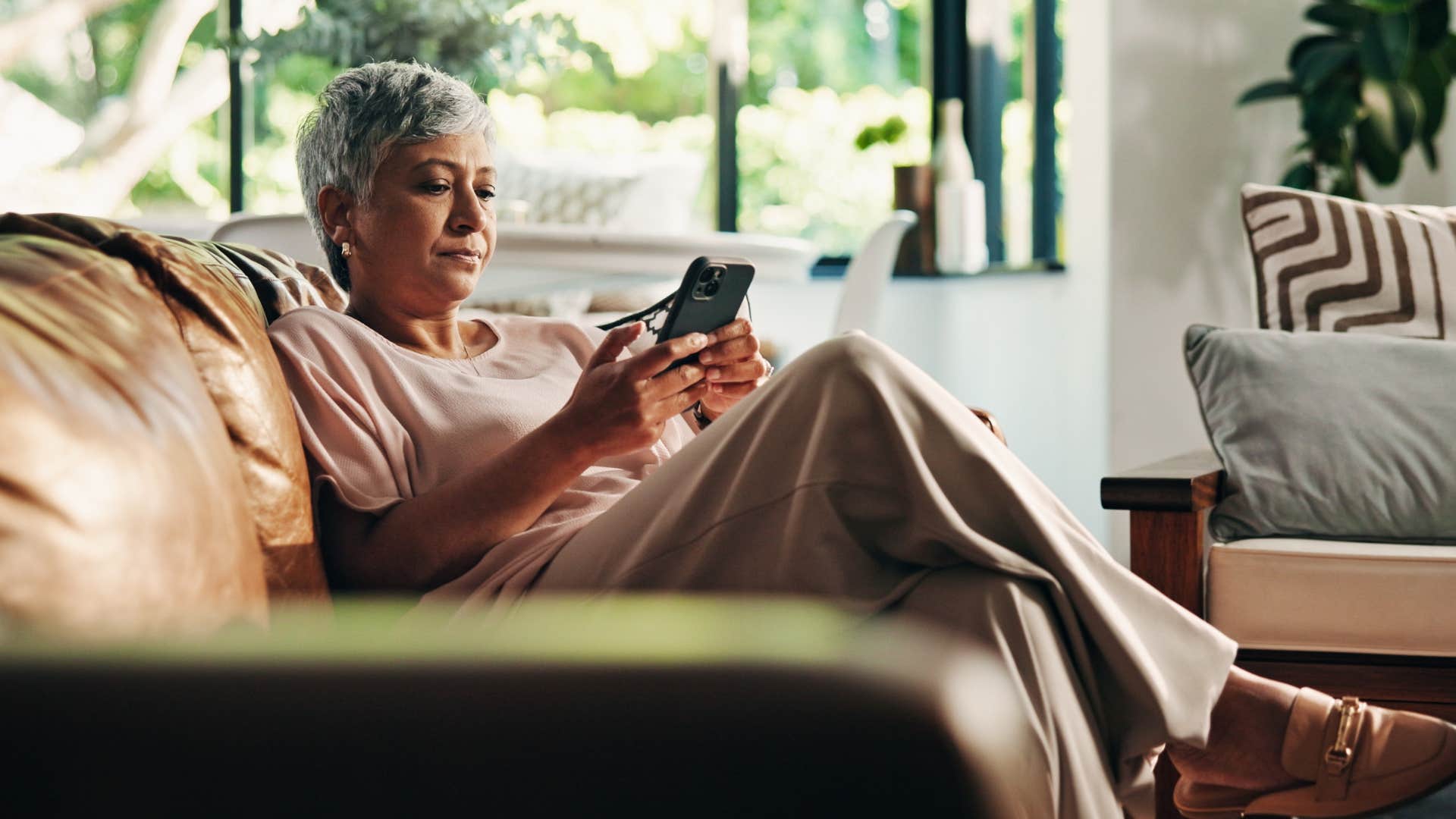 tired woman canceling plans texting my couch and sanity require my presence