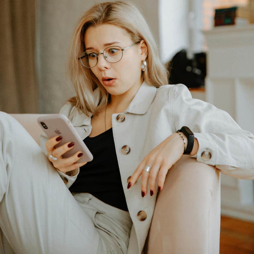 woman shocked by ChatGPT on her phone