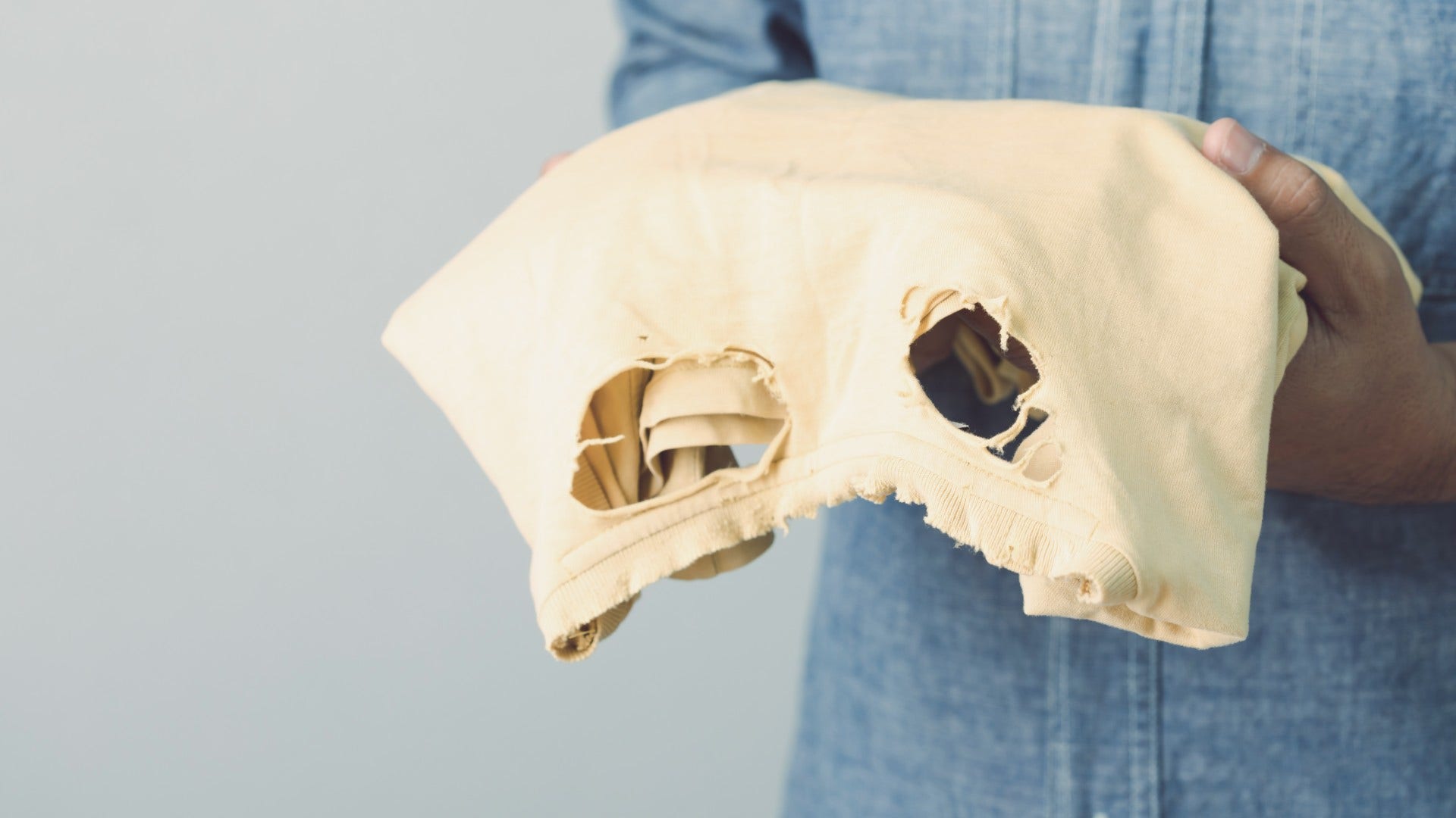 sentimental person holding onto an old piece of clothing