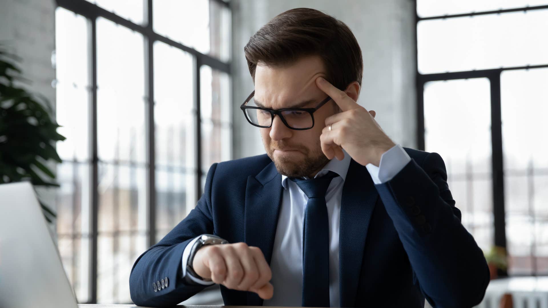 intelligent man annoyed by clock ticking sound