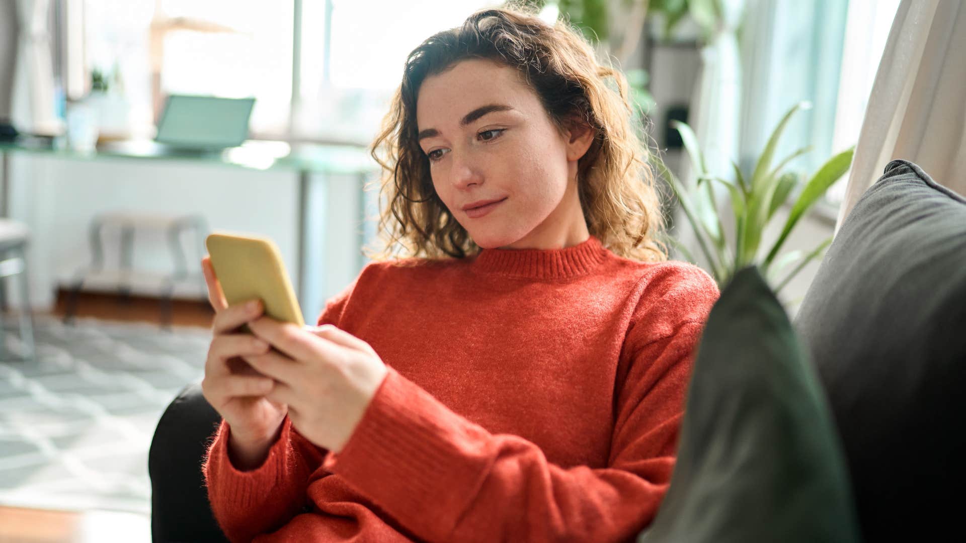 woman looking at her phone notifications