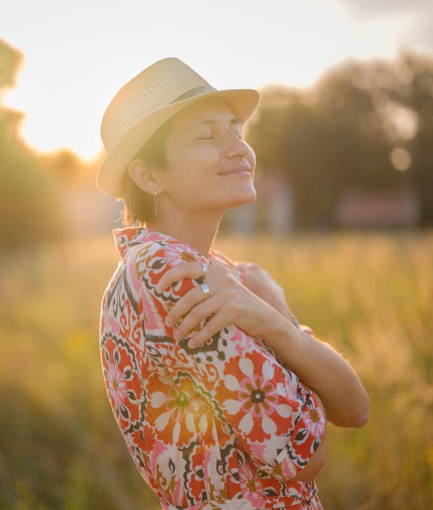 Confident person hugs themself 