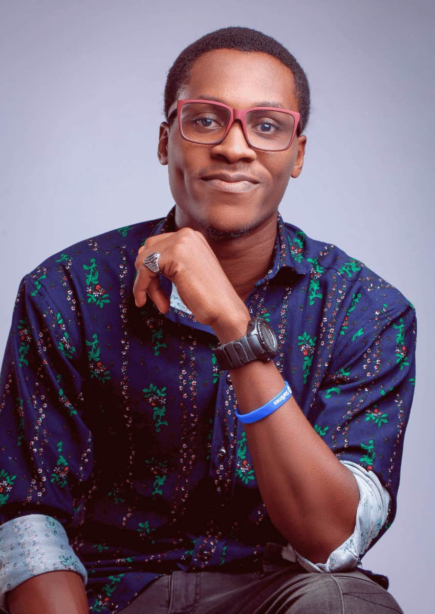 confident young man in glasses