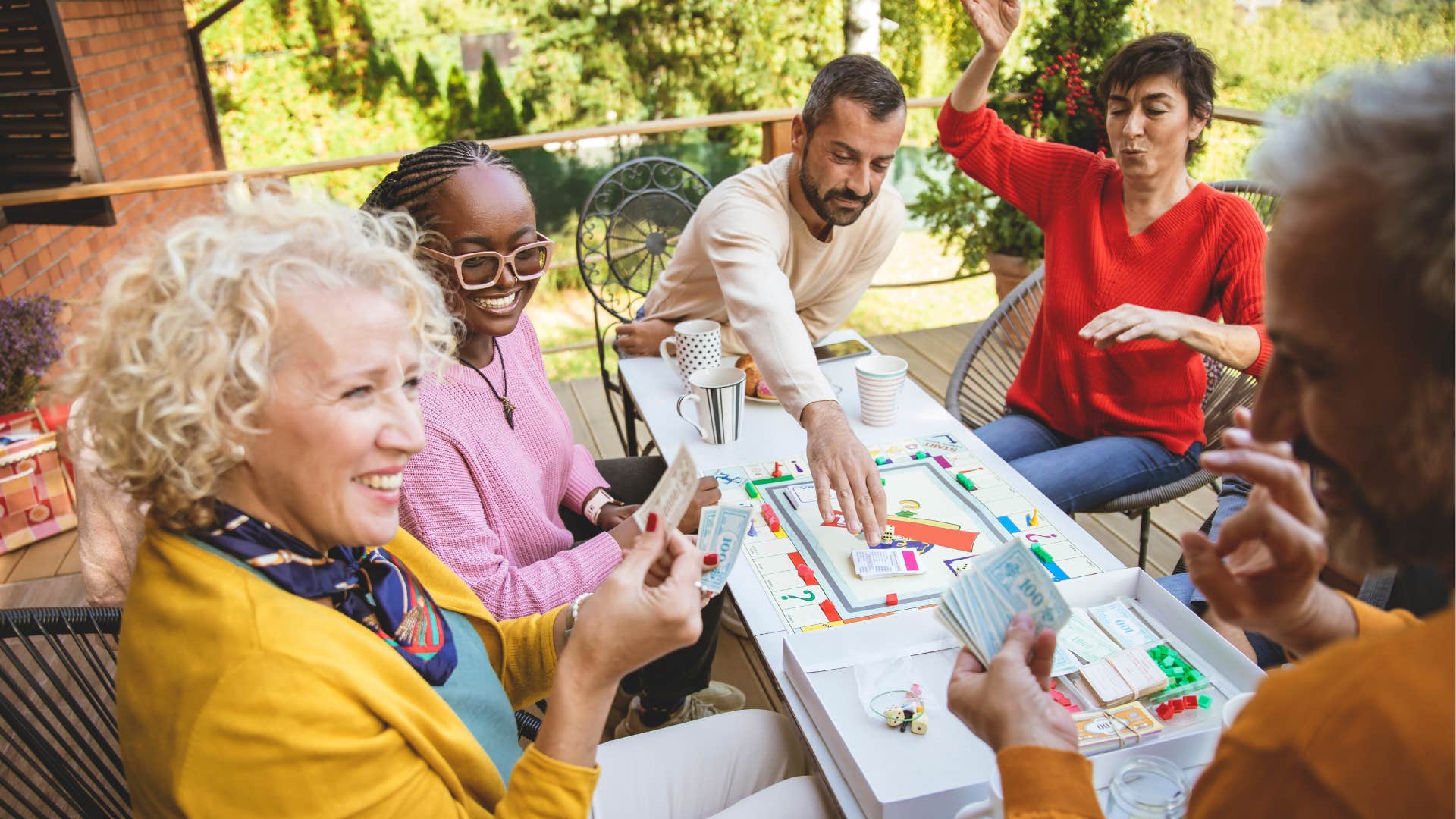 Group of older friends play game showing fun daily habit