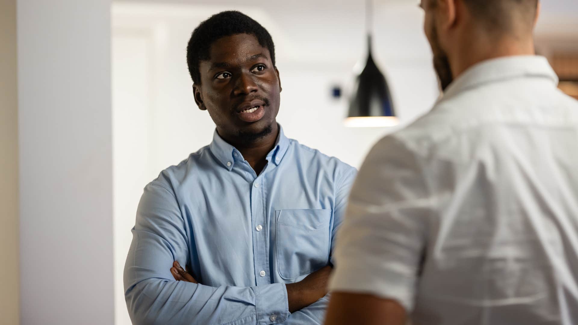 Man who holds conflicting ideas at the same time at work.