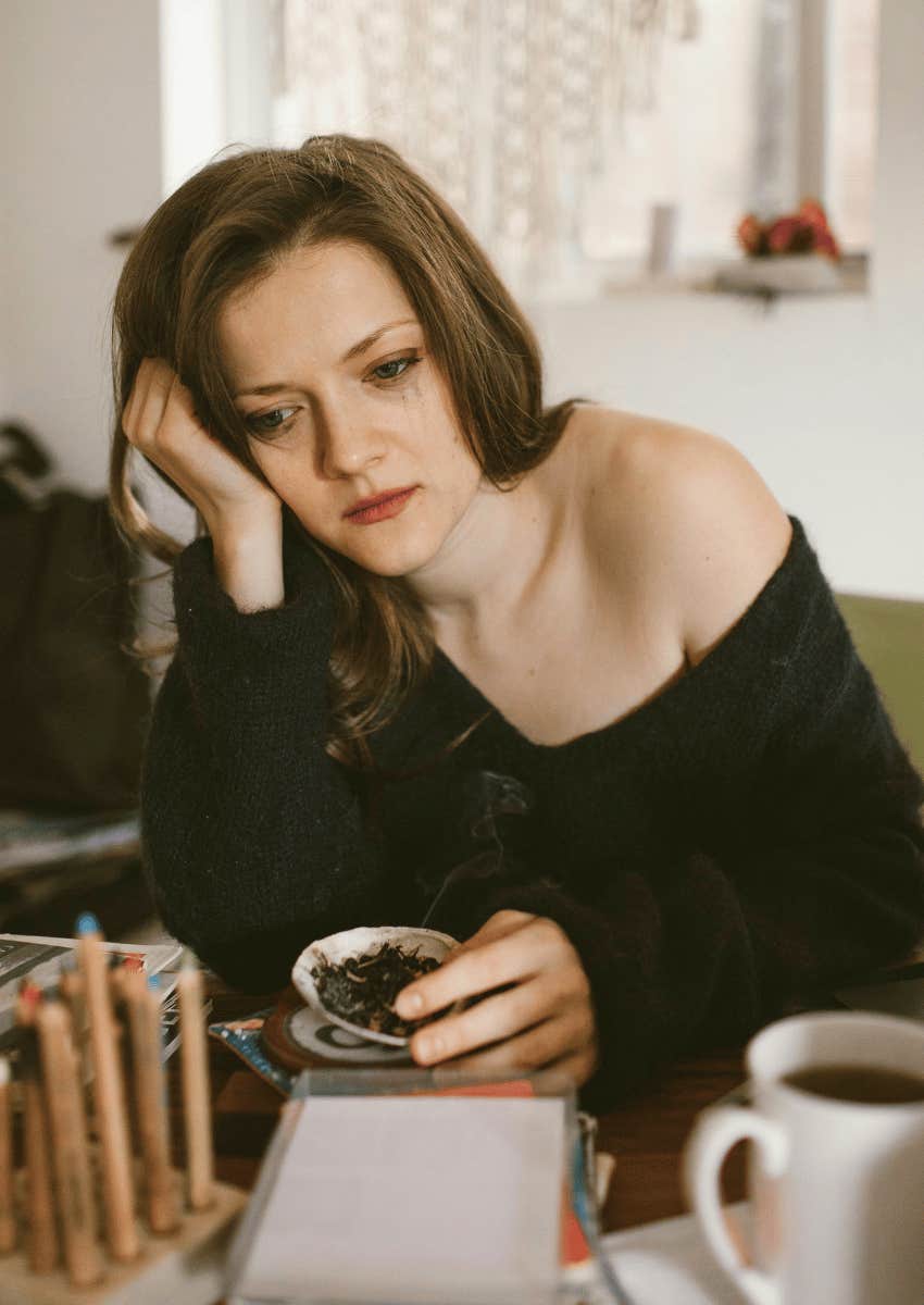 devastated young woman grieving the loss of a loved one