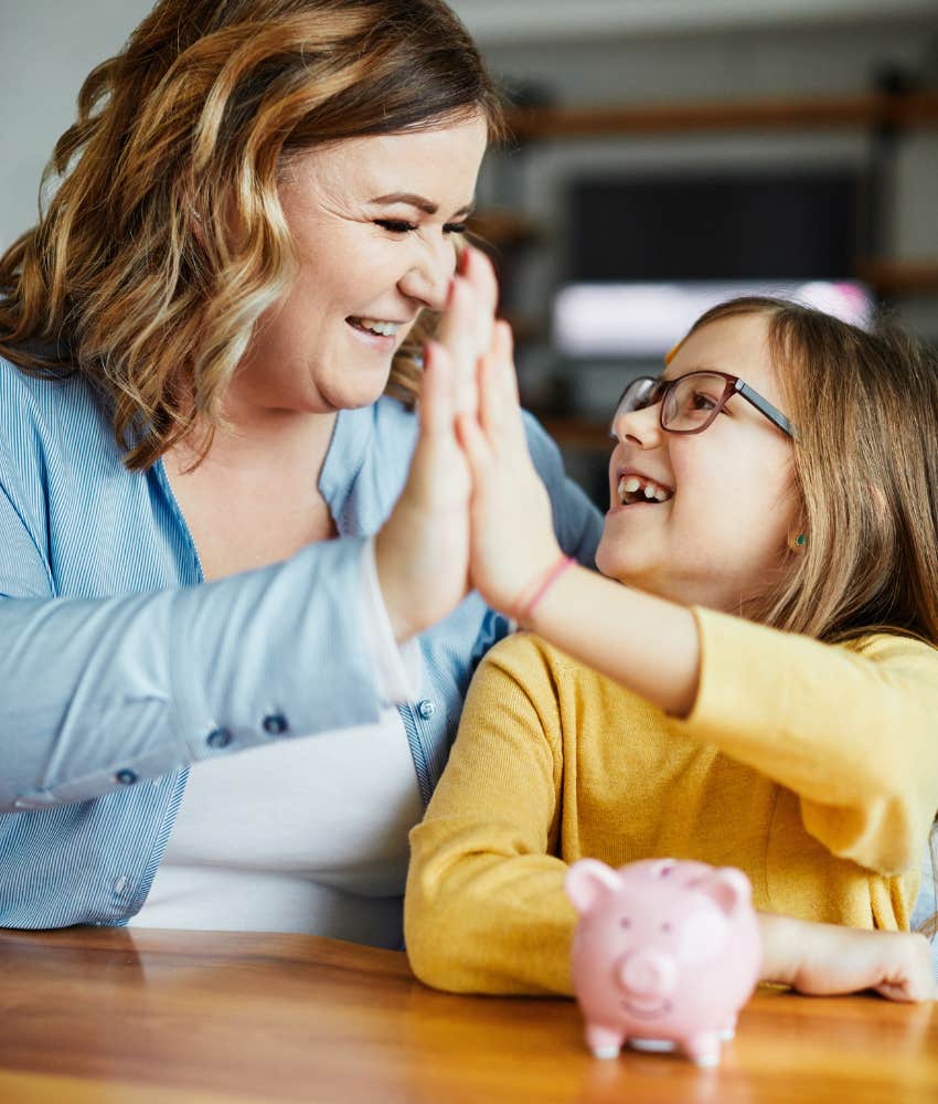 Excited mom and kids save money showing budget after divorce