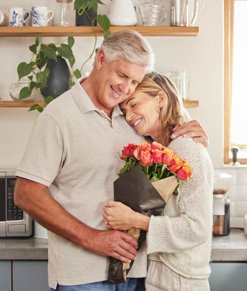 man giving wife bouquet of roses valentines day gifts middle class barely afford