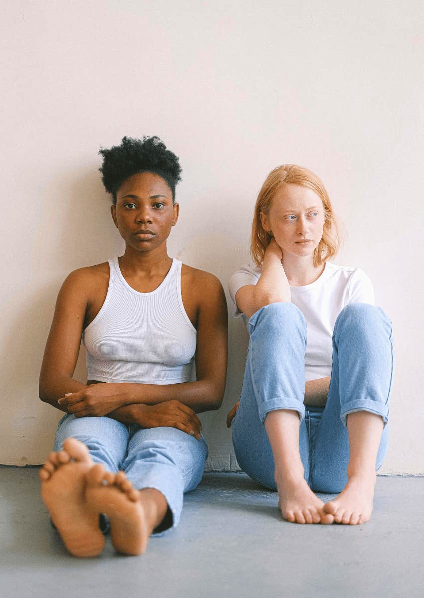 embarrassed woman looking away from partner