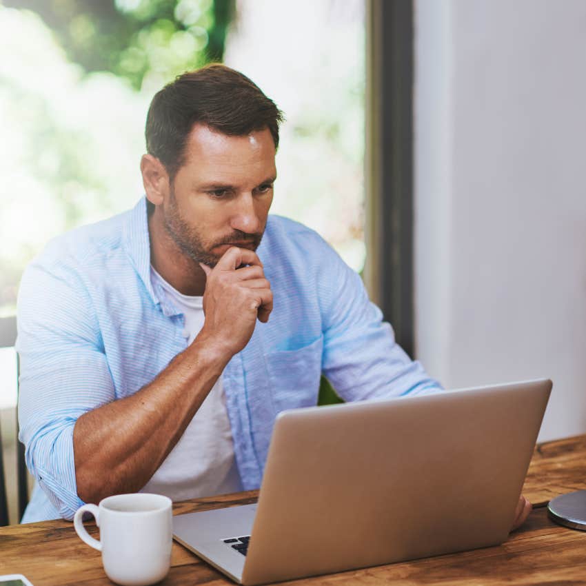 man reading an email from employer after job offer revoked asking about benefits