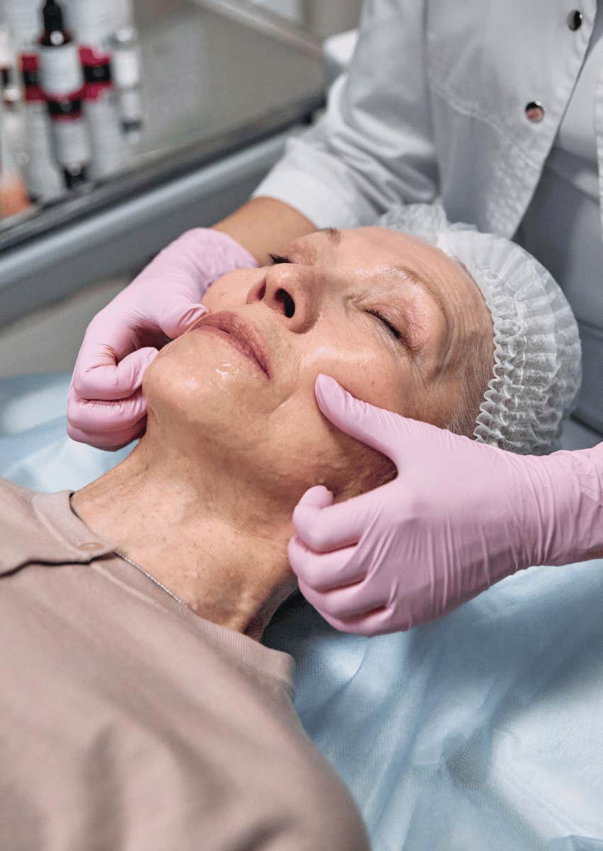 middle class woman paying for expensive anti-aging treatment
