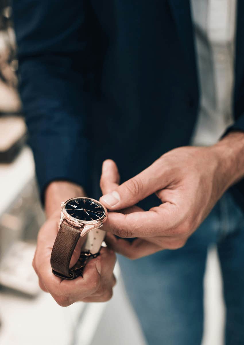 man trying on fancy expensive watch