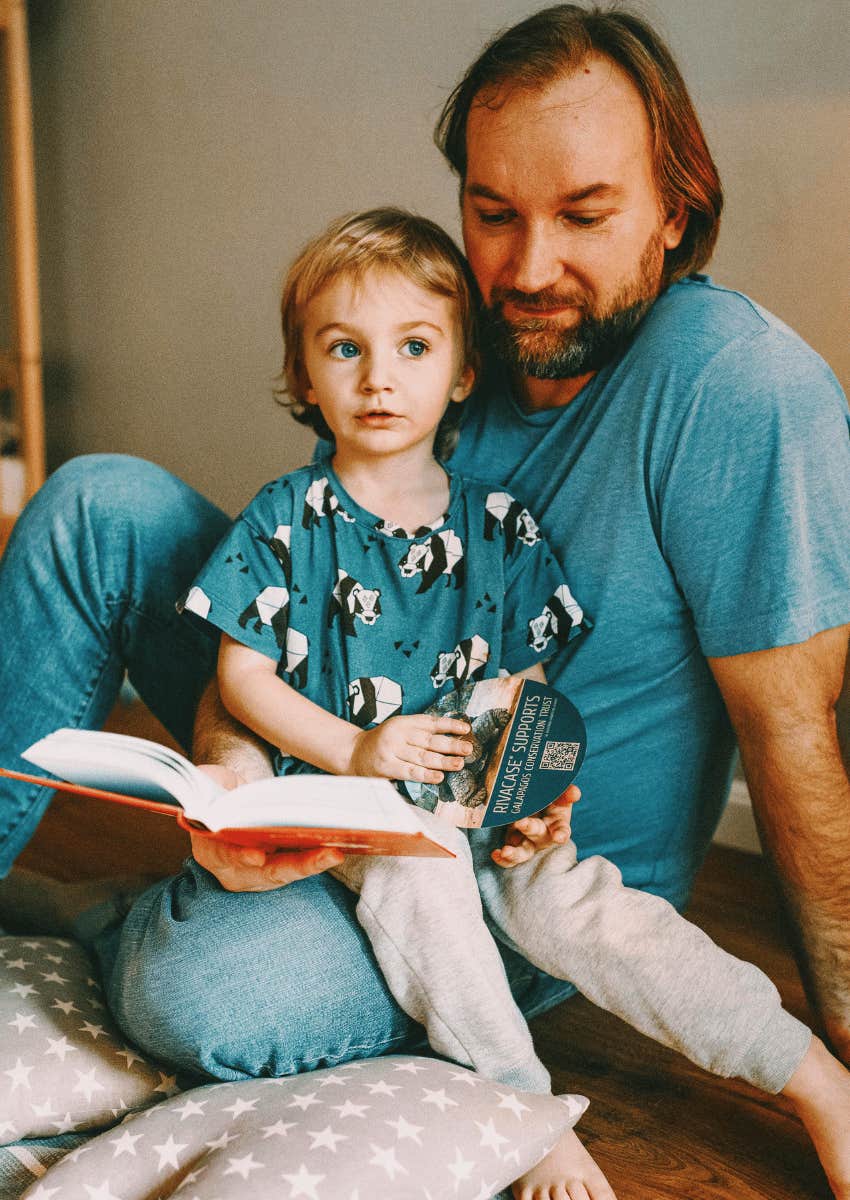 father and son sitting side by side