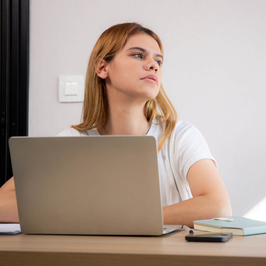 woman thinking about quitting her job