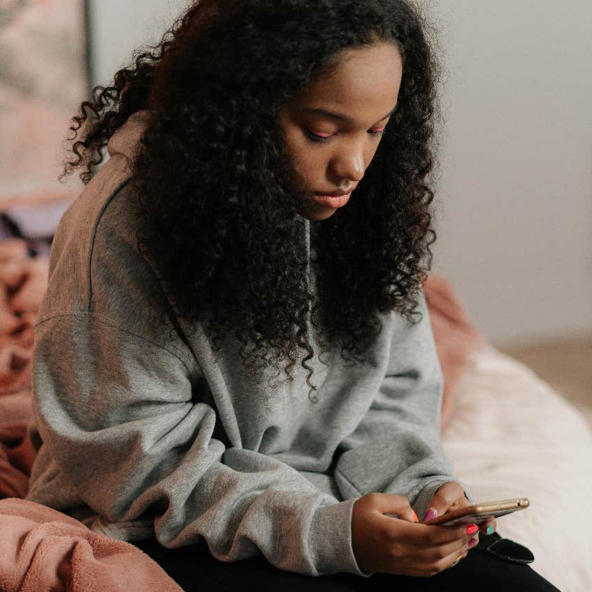 gen z woman on her phone instead of socializing