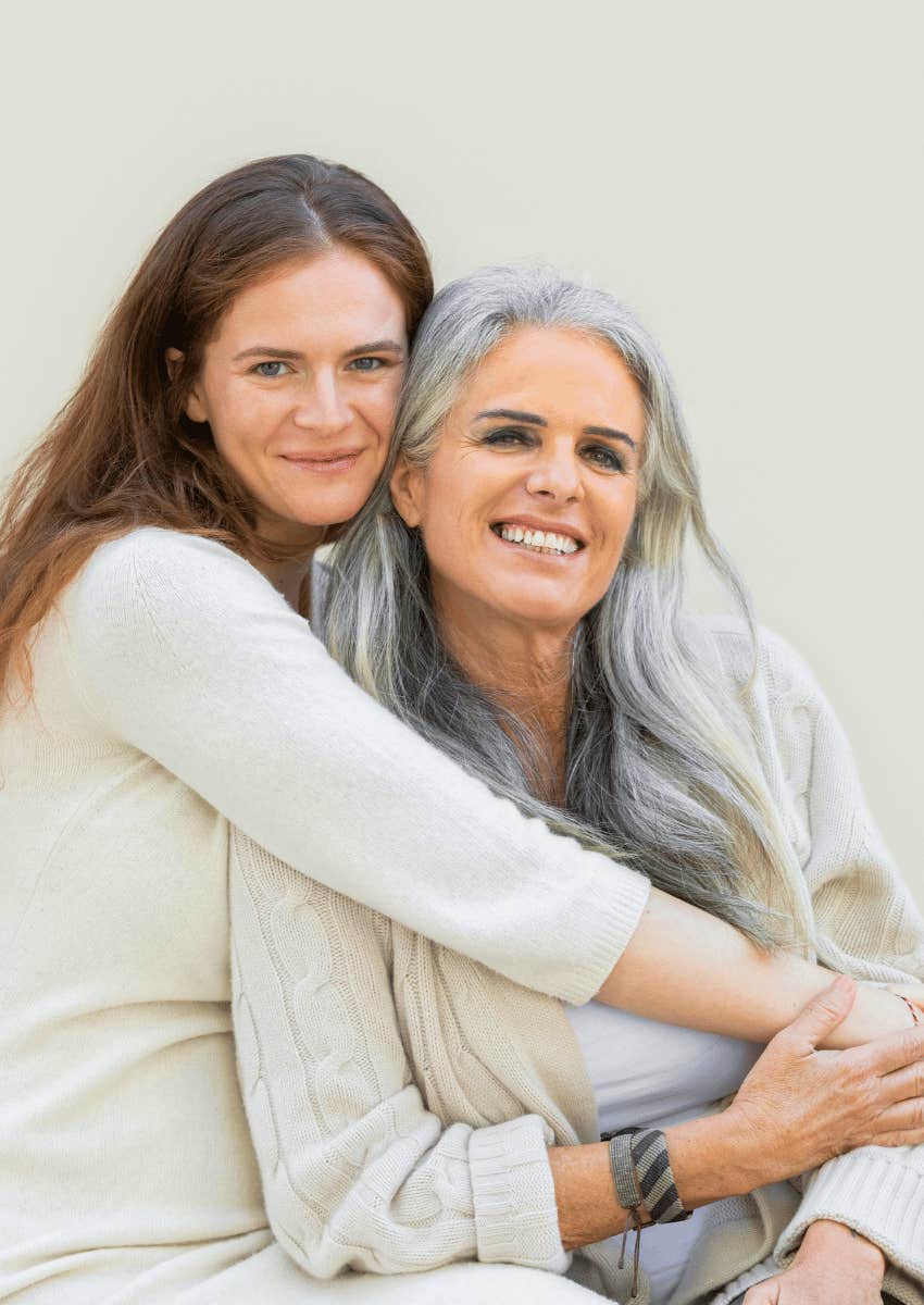 happy older female couple hugging