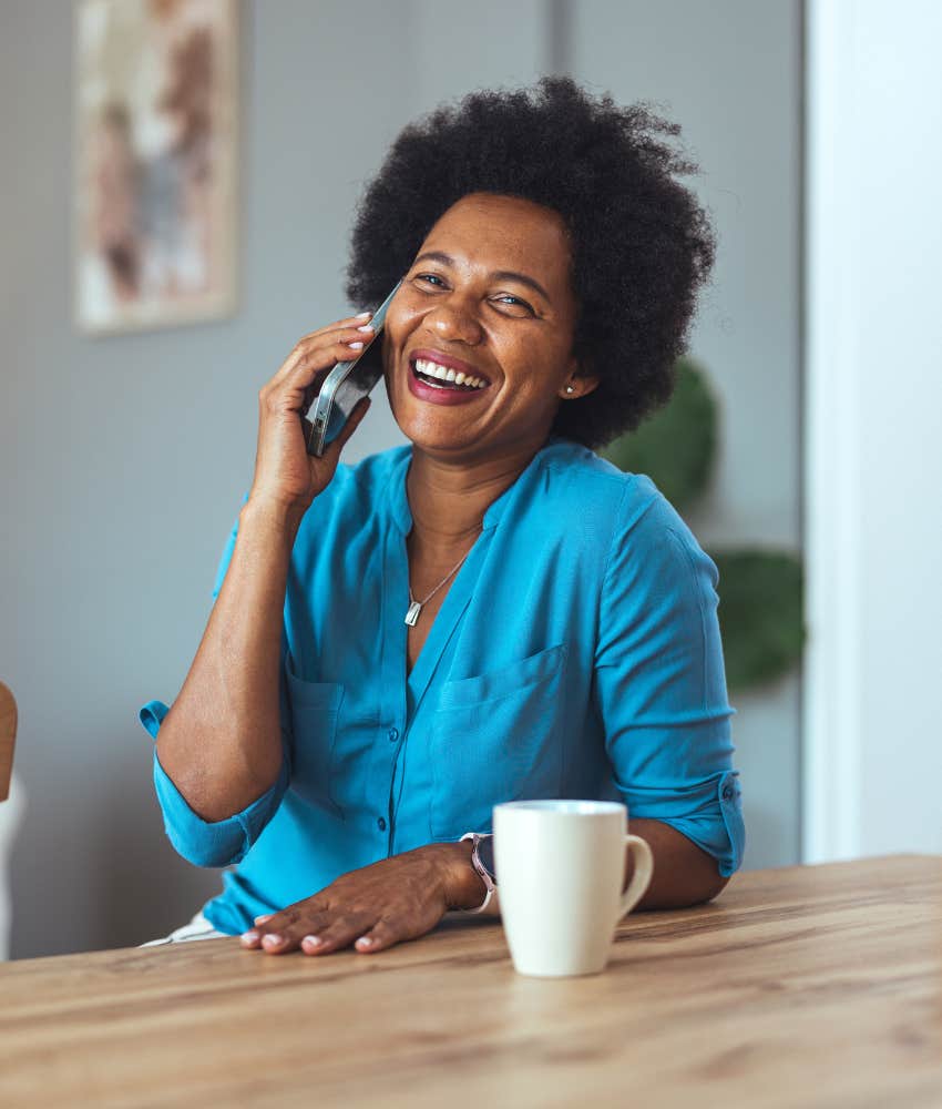 HAppy person talks on phone showing emotions make better decisisions