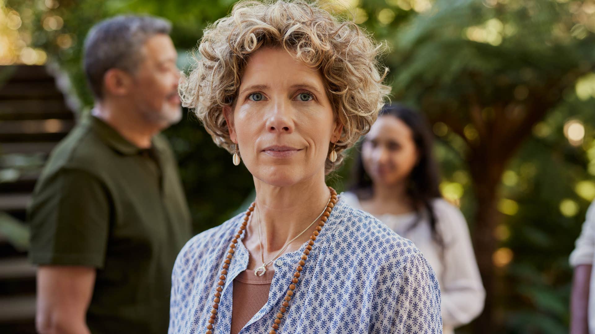 high iq woman who's quieter than most standing in crowd