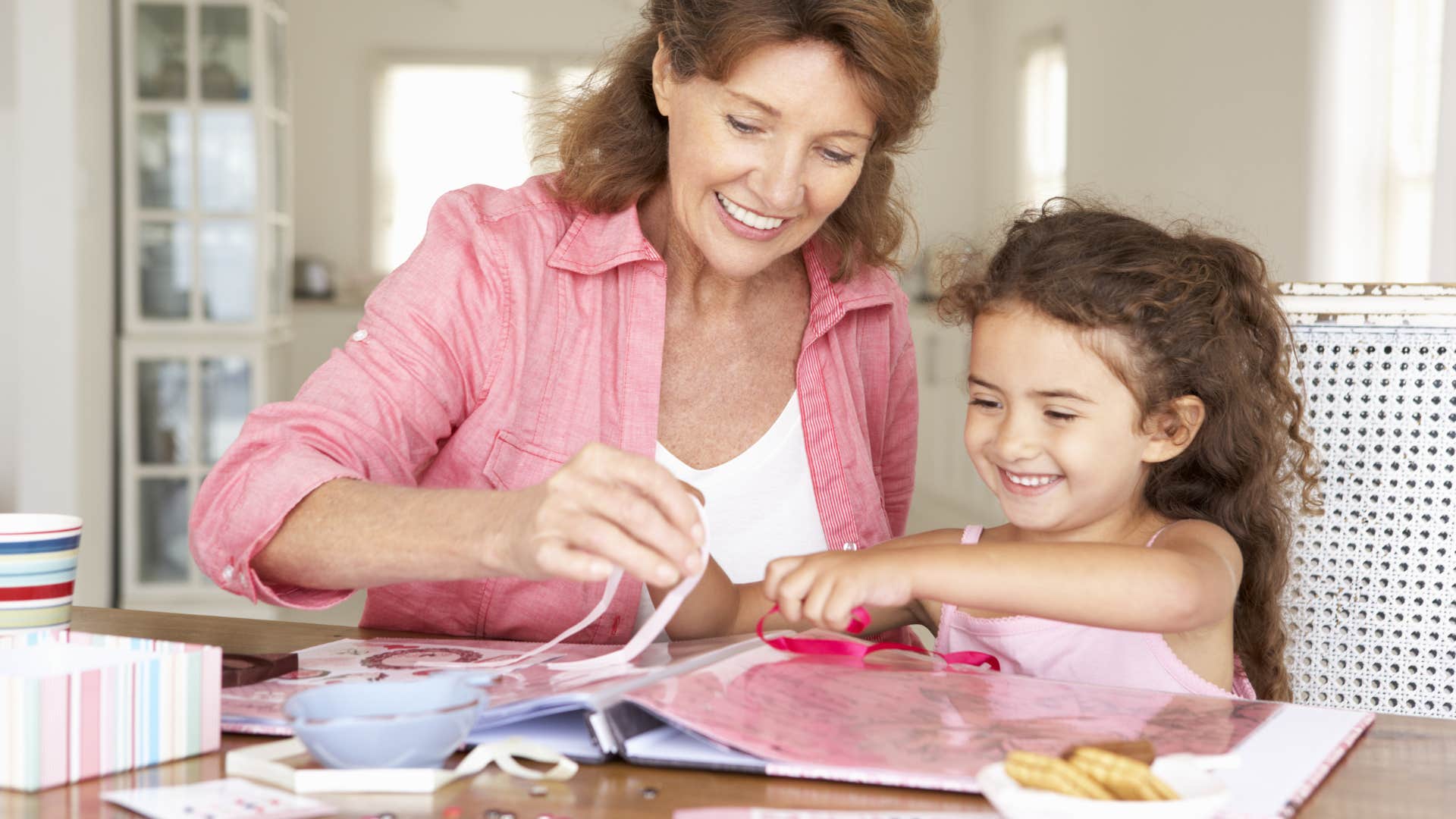 grandma and granddaughter scrapbooking