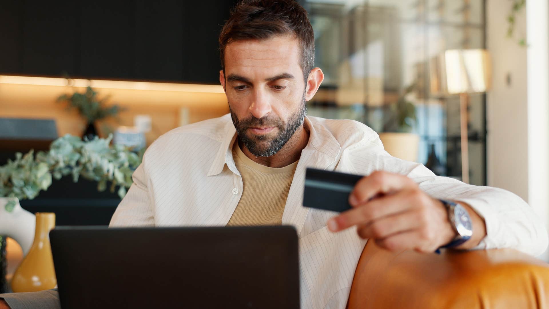 lonely man who overspends on material things online shopping