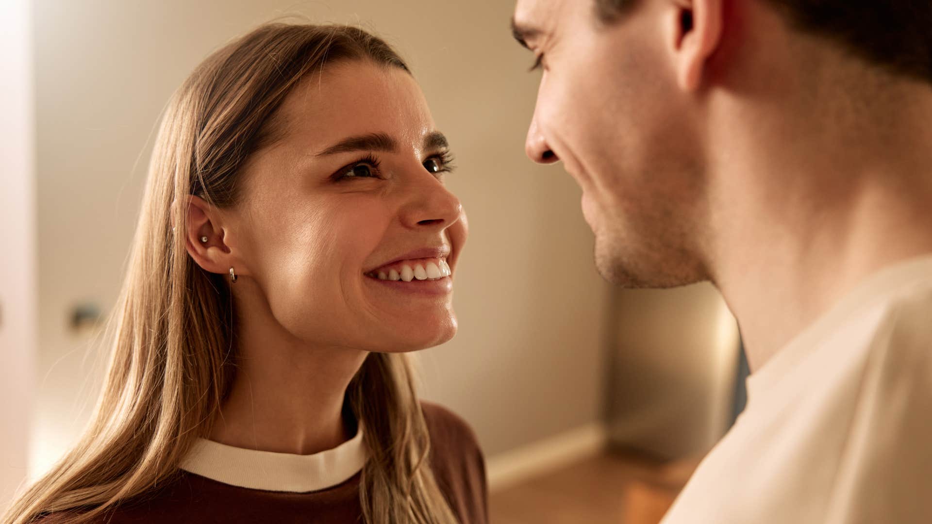 man who substitutes emotional intimacy with physical touch smiling at partner
