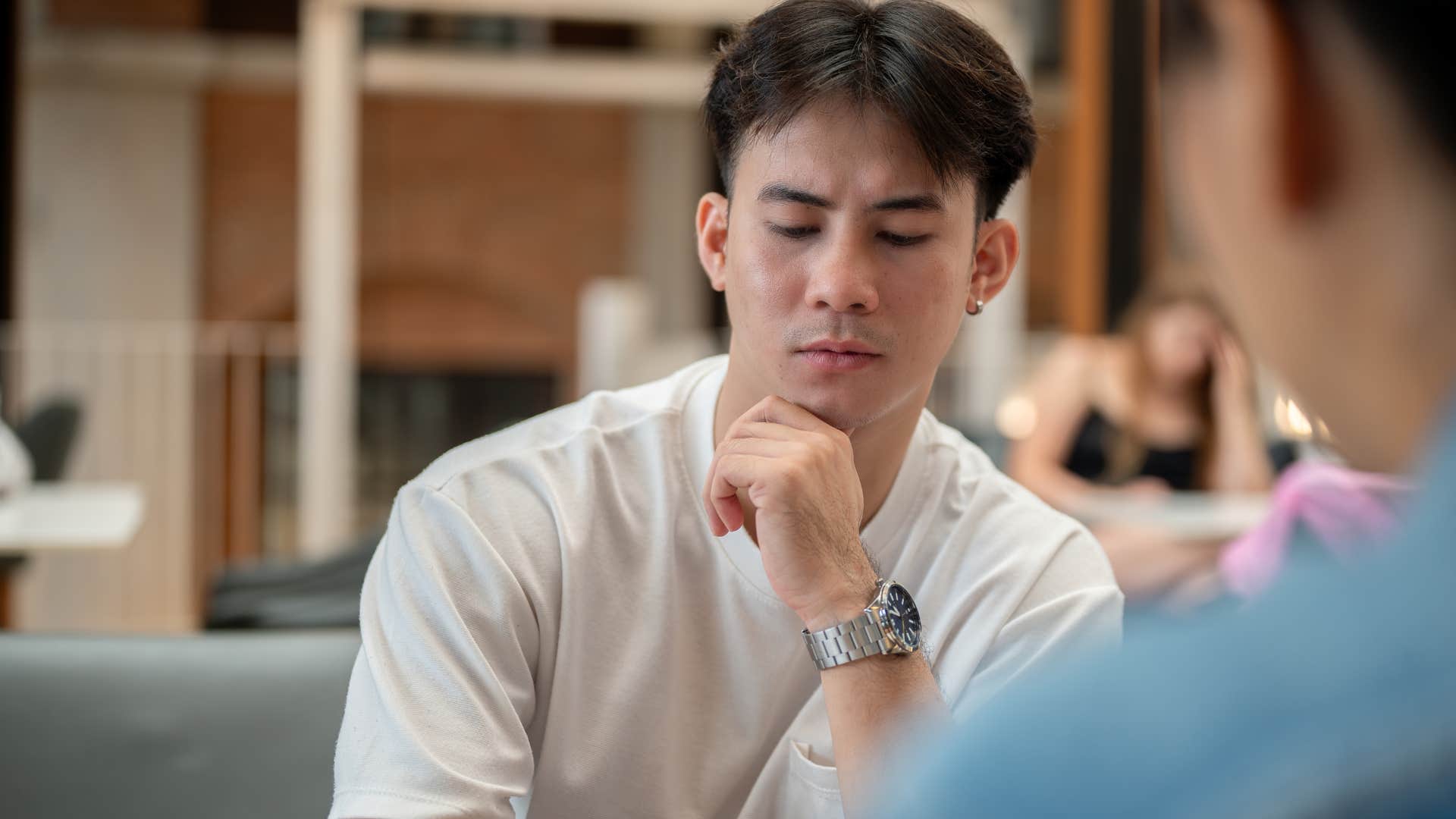 man with no close friends using humor to deflect vulnerability in conversation