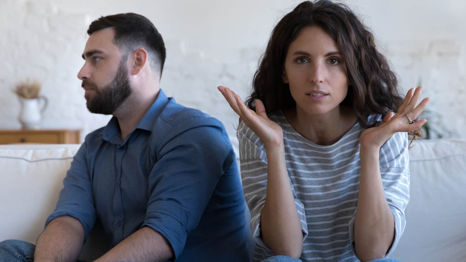 selfish man saying I don't need help to his annoyed wife