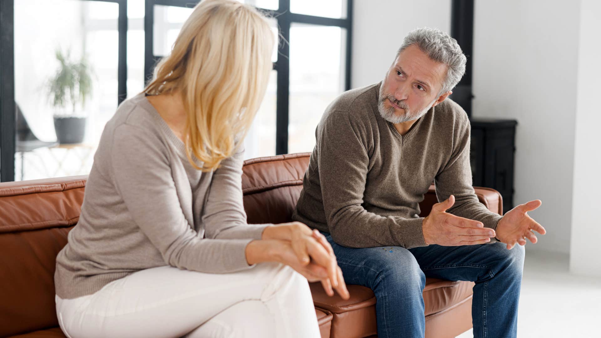 man arguing with wife saying stop trying to control me