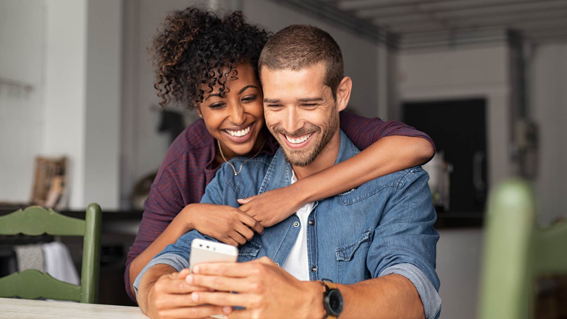 man who is in it for the long haul smiling with his girlfriend