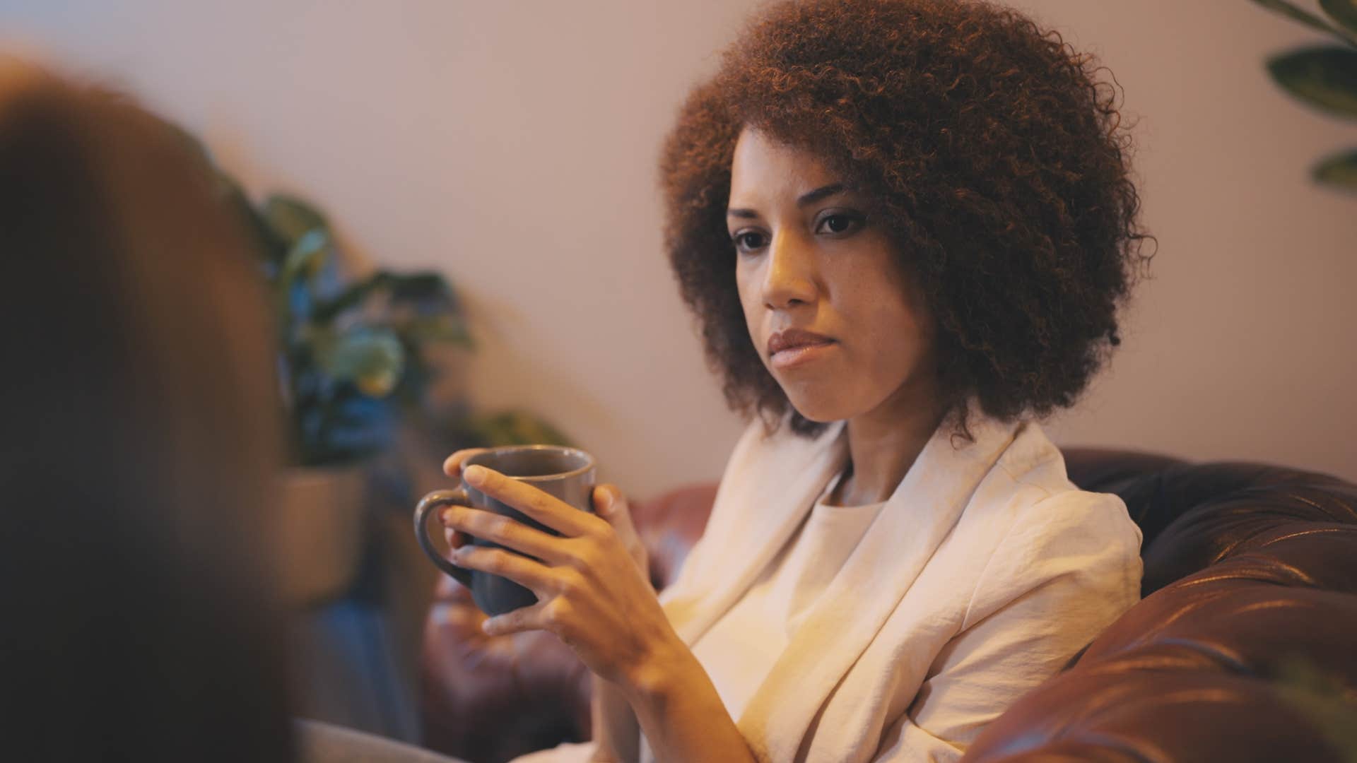 woman obsessively monitoring body language and tone in conversation