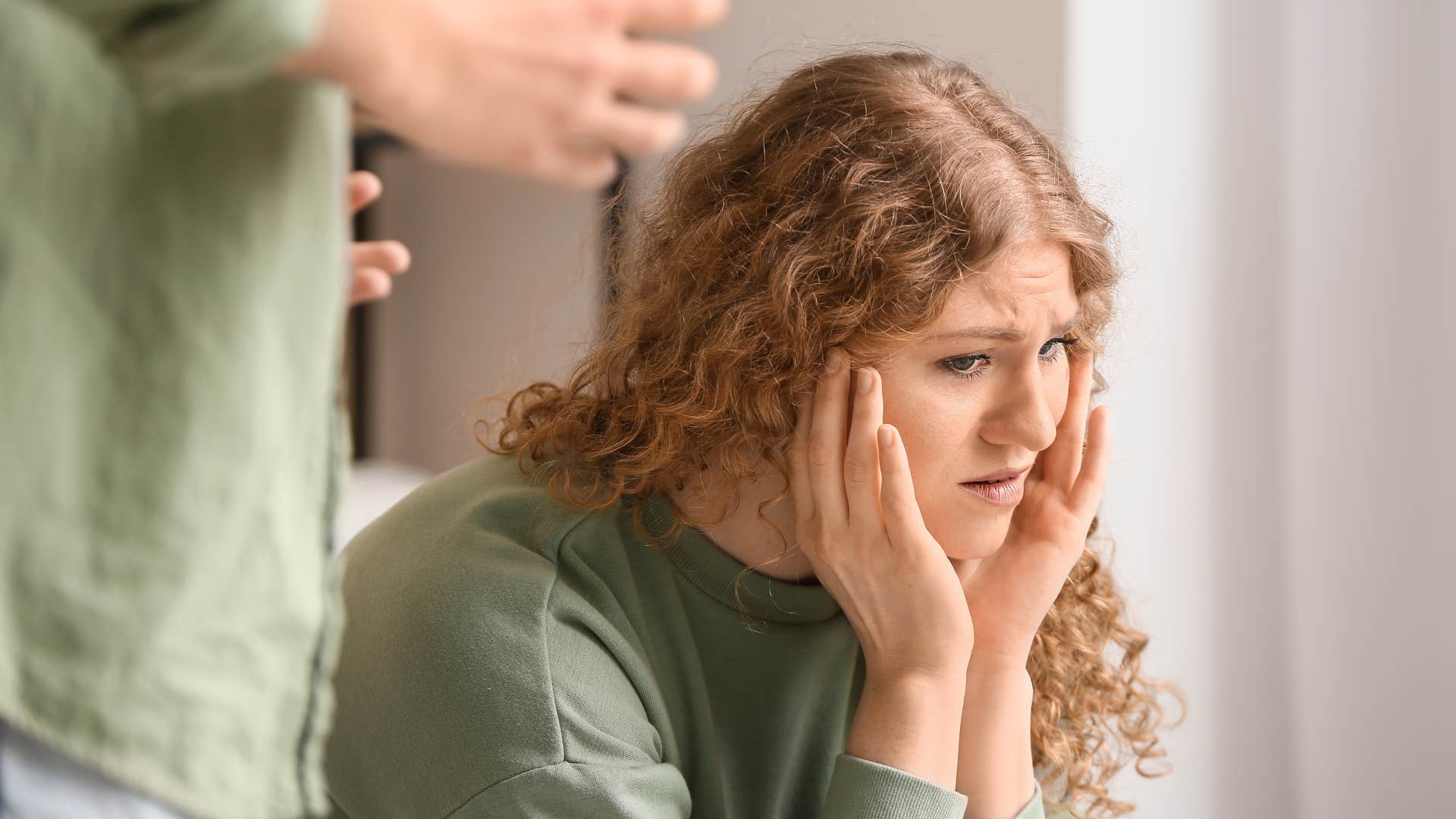 woman who feels drained by her relationship detaching emotionally 