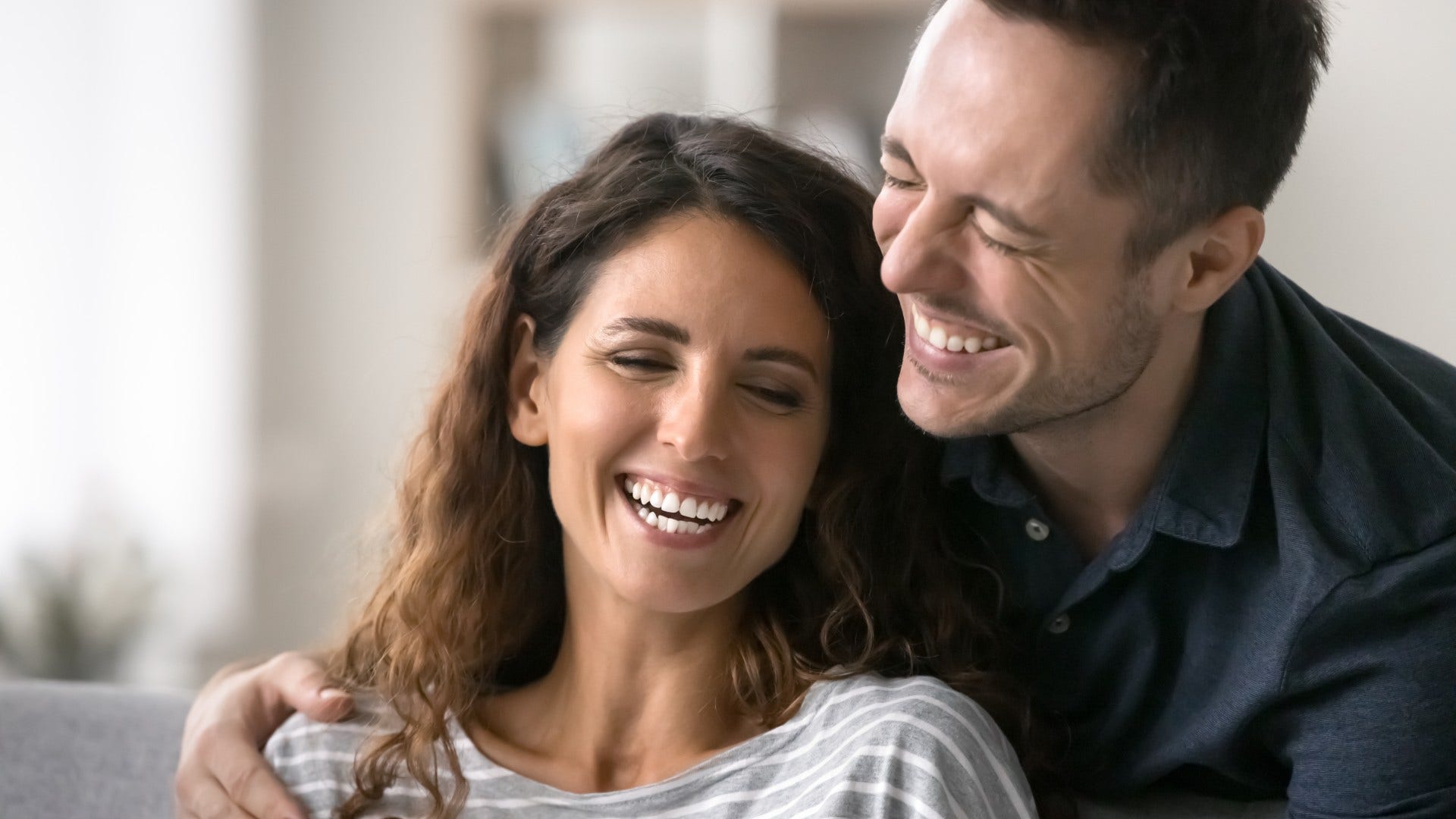 couple who is probably solid laughing about them both being imperfect