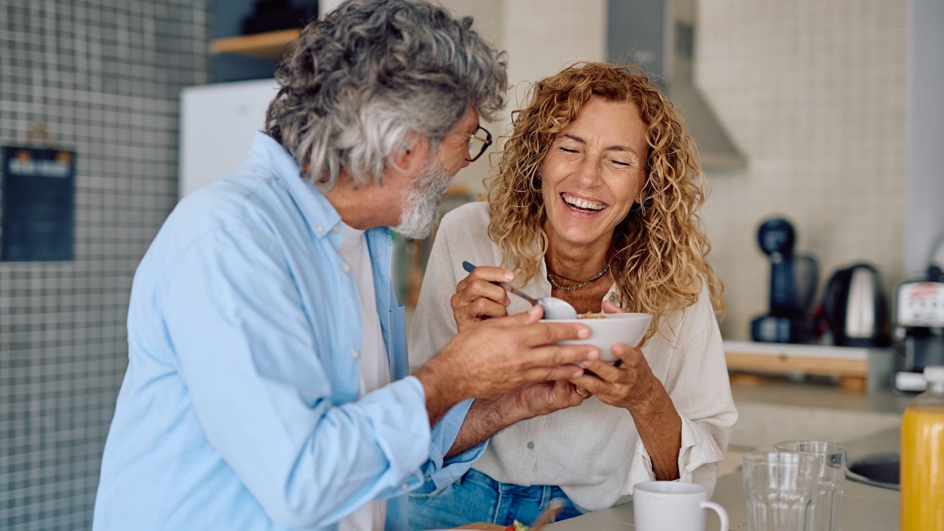 couple who is probably solid laughing about different communication styles