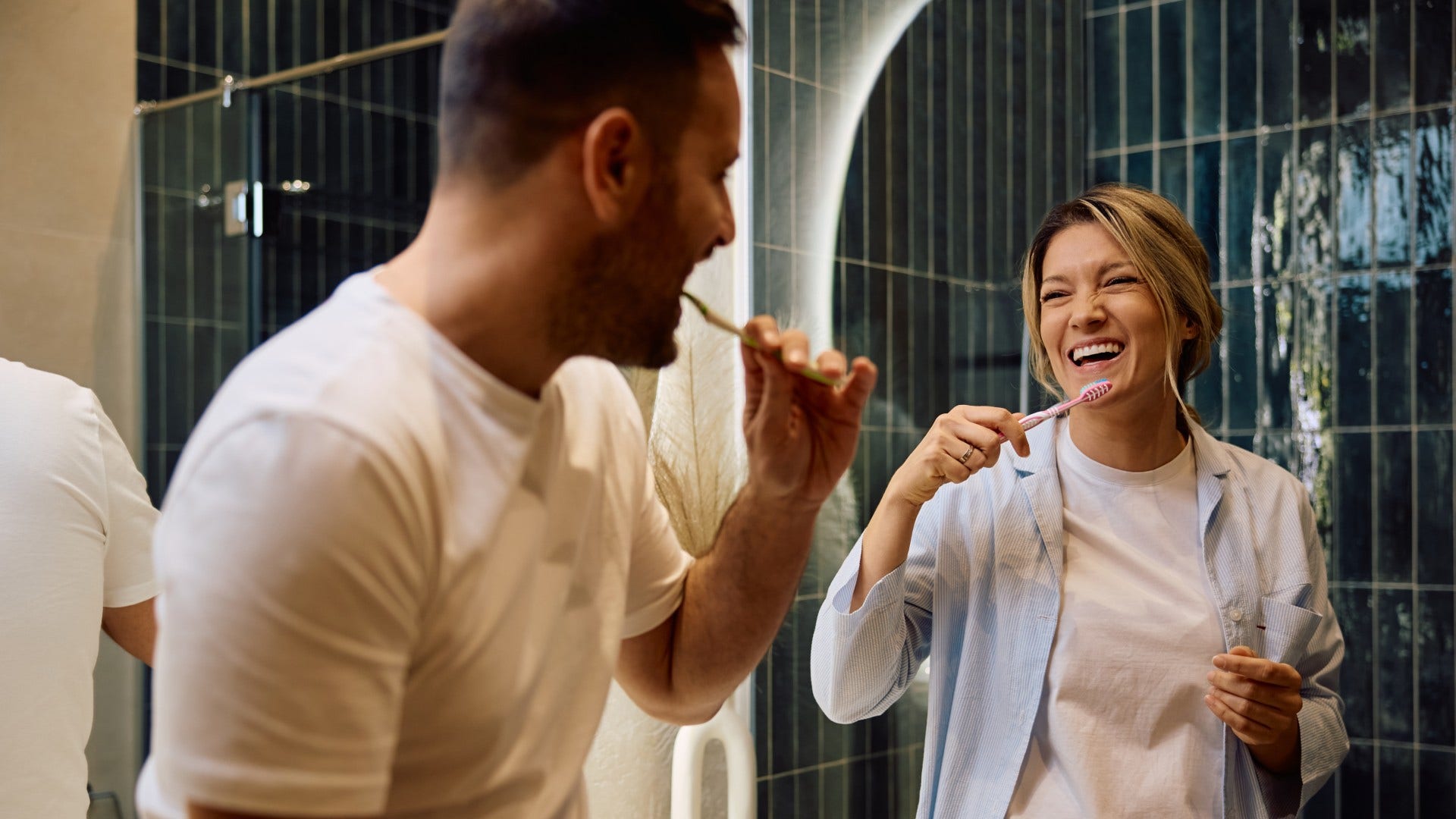 couple who are probably solid laughing about the early relationshio awkwardness