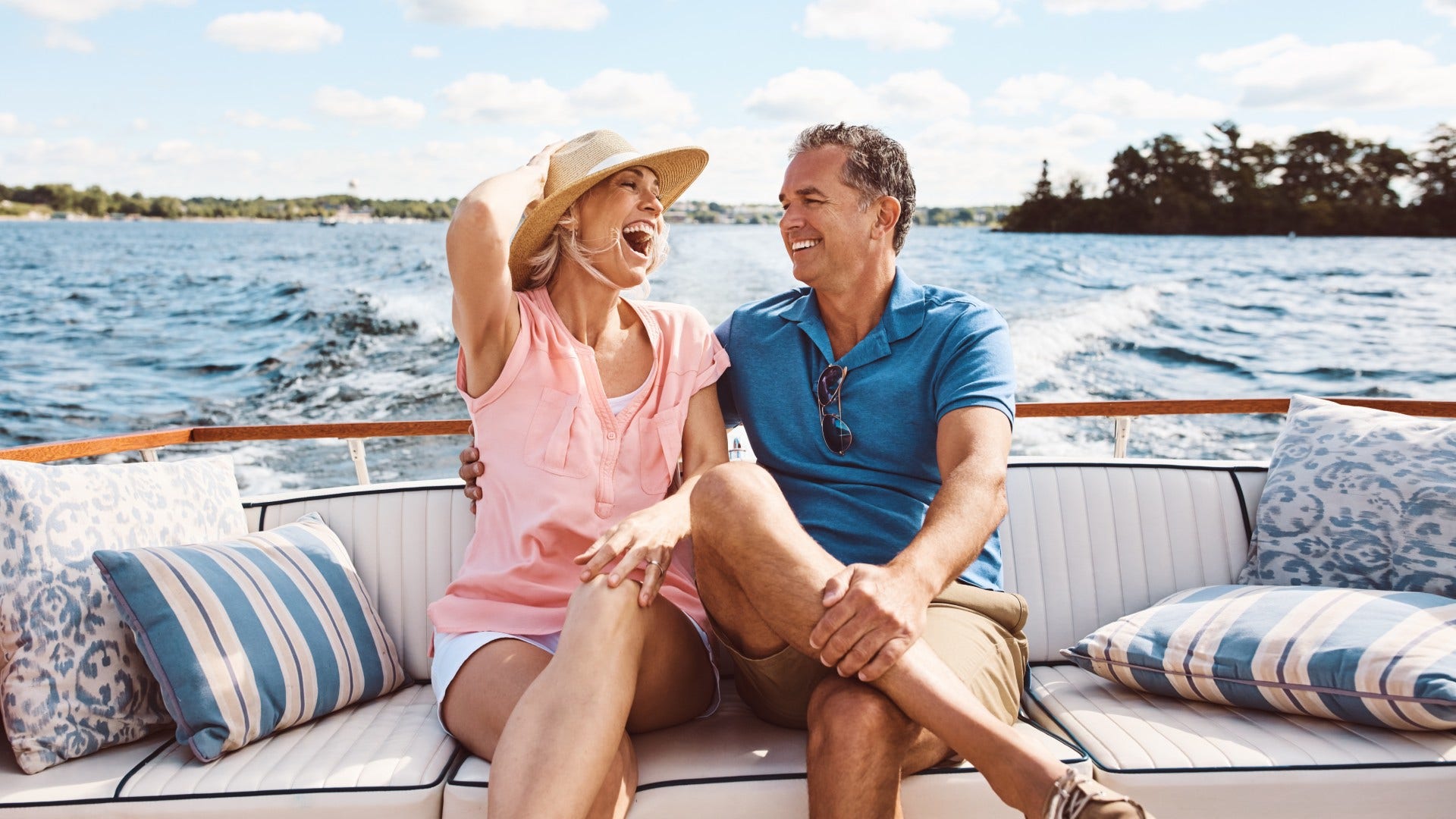 couple who is probably solid laughing about minor financial mishaps