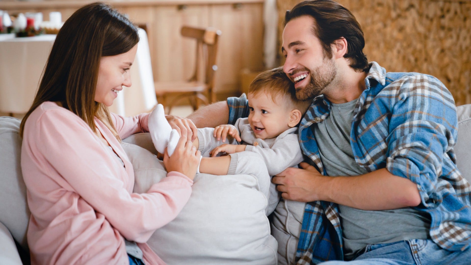 couple who is probably solid laughing about parenting chaos