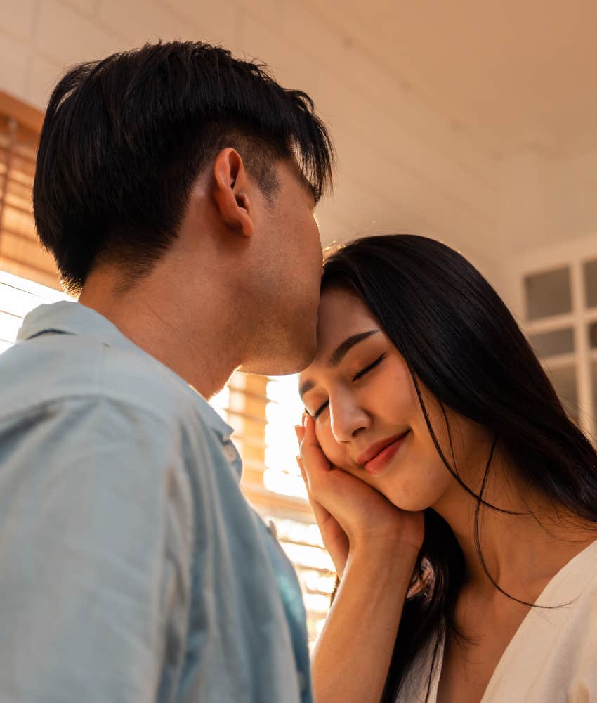 Loving person kisses partner showing way to resolve feeling distant