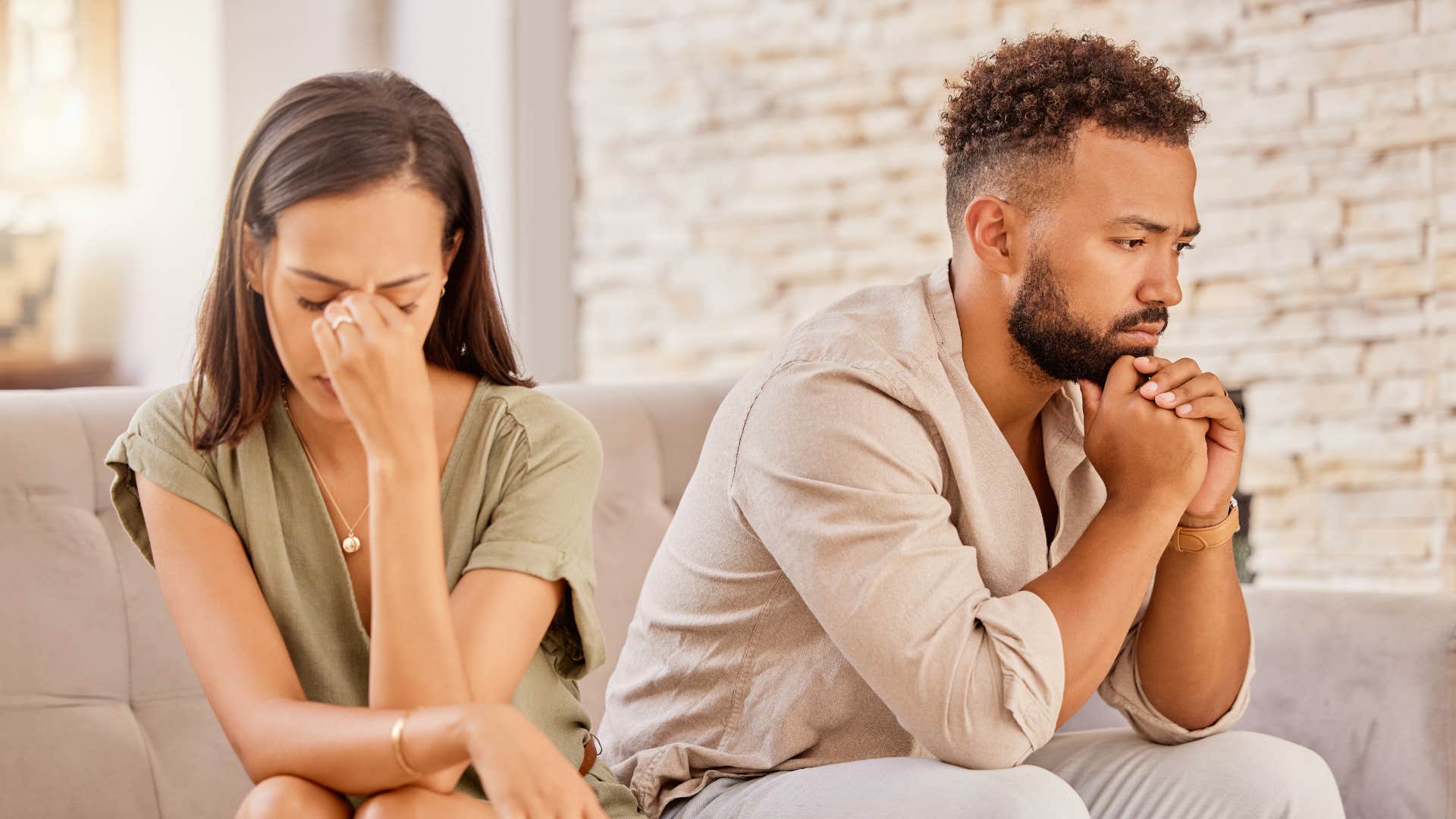 Unhappy couple sit showing respect is at center of relationship world