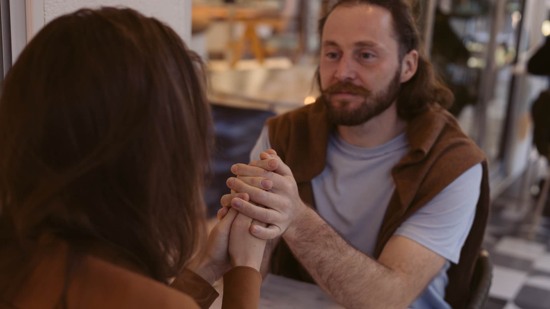 man who cares more about depth than superficiality talking to partner
