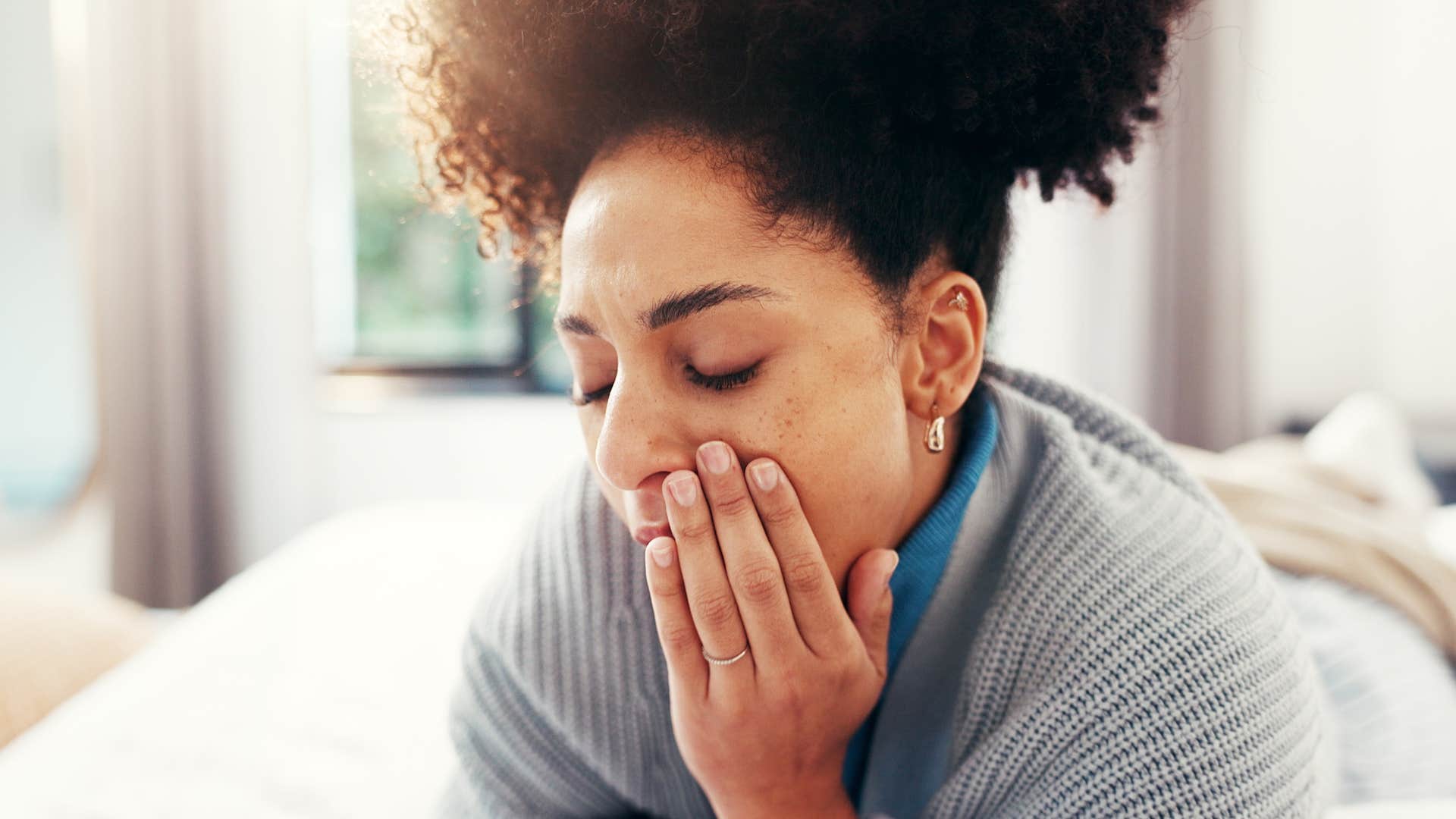 sensitive woman sitting alone at home