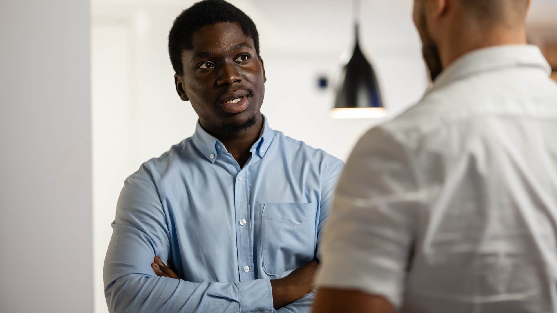 man who's slow to trust talking to his friend