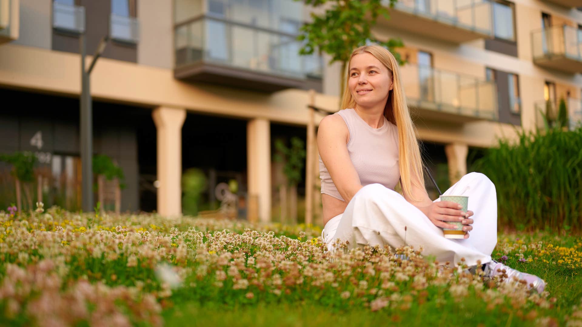 young intelligent woman sitting outside in nature