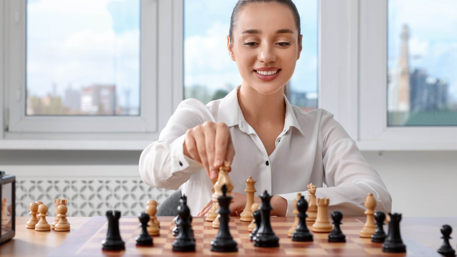 highly intelligent woman playing chess