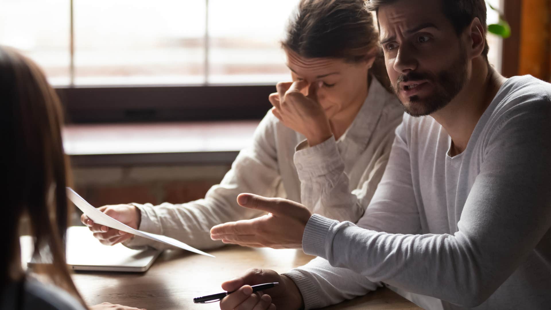 Frustrated person tired of complaining coworker showing wrong career