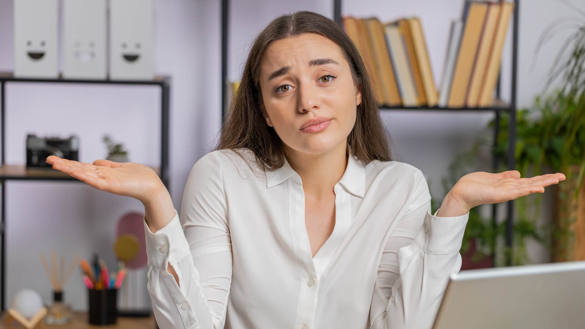 Uncertain person shrugs showing wrong career