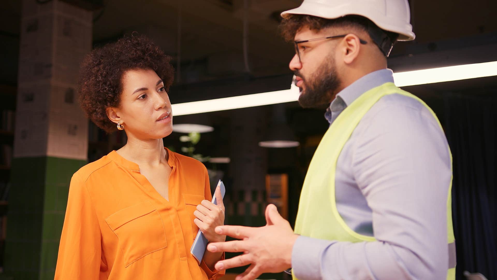 Woman who's adaptable to their environment talking at work.