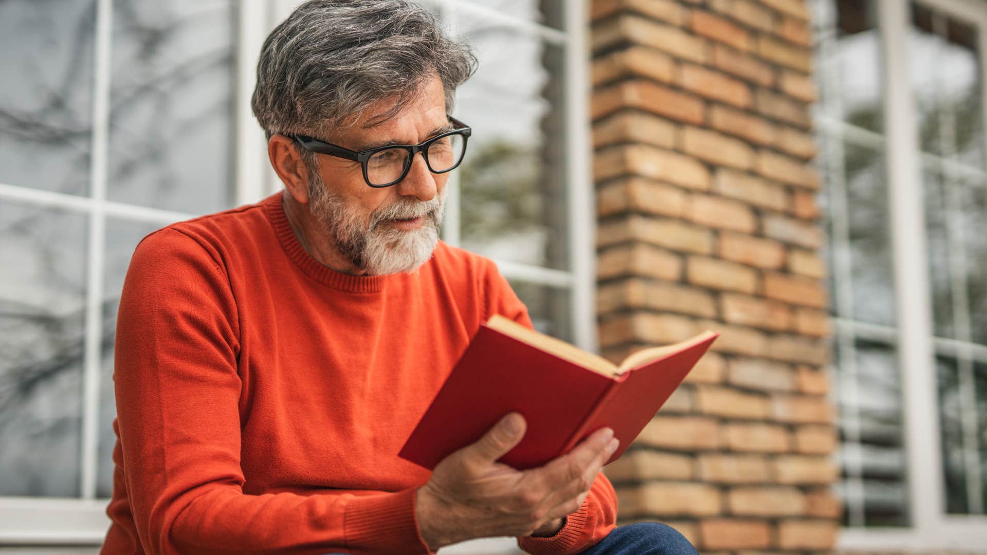 Man who's not obsessed with performance or aesthetics reading a book.
