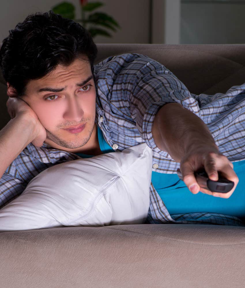 Imperfect man watches TV late at night showing habit 