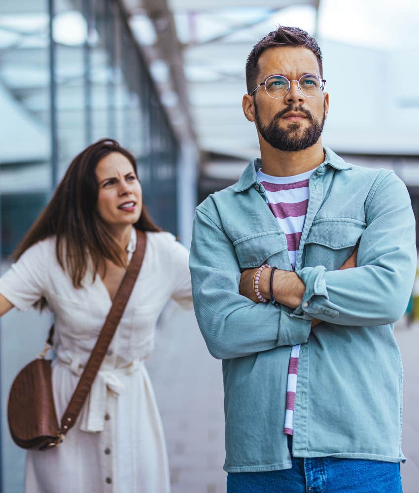 Defensive man ignores upset woman showing imperfect part of love