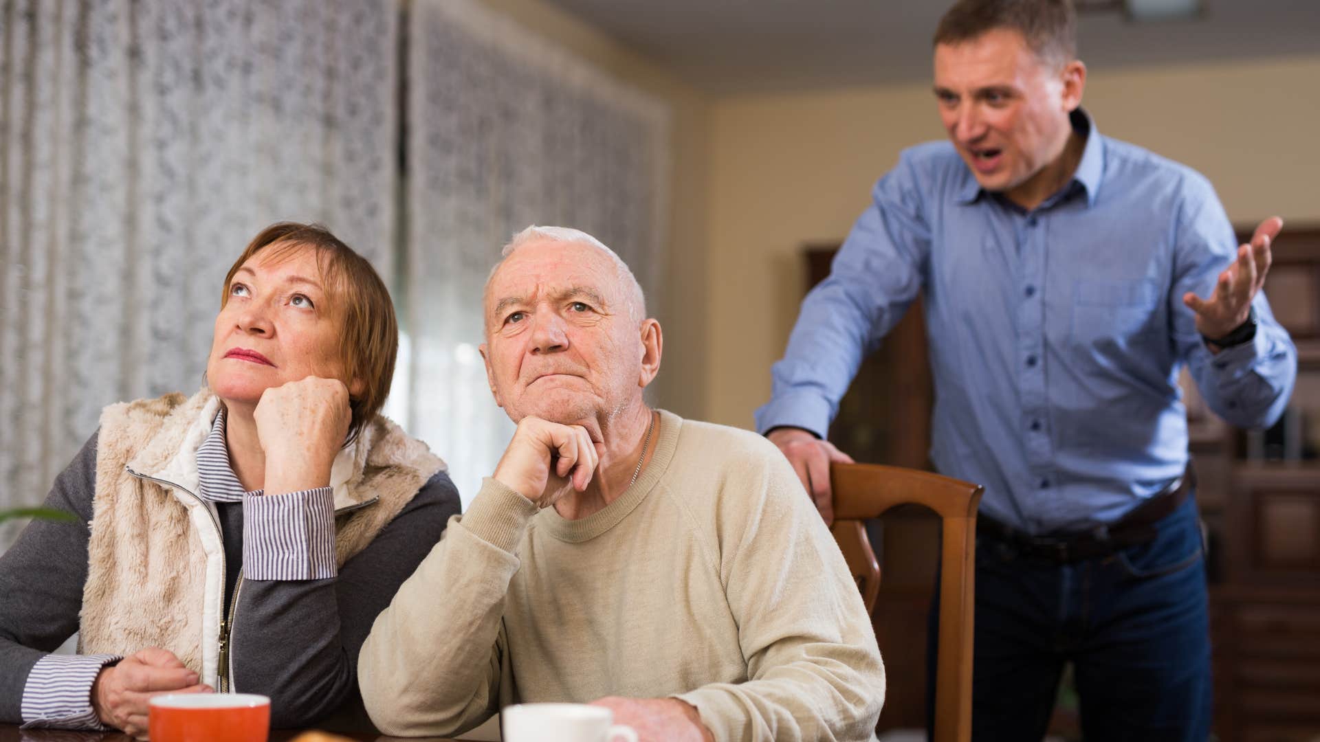 man yelling at his parents saying can't you see I'm struggling